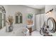 Stylish bathroom features a soaking tub and decorative shutter, offering a blend of comfort and unique design at 592 Woodcrest Dr, Gastonia, NC 28056