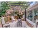 Relaxing outdoor deck space featuring a pergola, comfortable seating, and serene views at 592 Woodcrest Dr, Gastonia, NC 28056