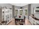Cozy dining area bathed in natural light with picturesque views at 592 Woodcrest Dr, Gastonia, NC 28056