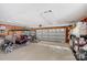 Spacious garage featuring a golf cart, a lawn mower and ample storage space at 592 Woodcrest Dr, Gastonia, NC 28056