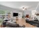 Spacious living room offering plenty of natural light, comfortable seating, and easy access to the home's outdoor spaces at 592 Woodcrest Dr, Gastonia, NC 28056
