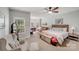 Expansive main bedroom featuring a sitting area and large windows, offering style and comfort at 592 Woodcrest Dr, Gastonia, NC 28056