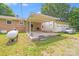Spacious covered patio with grill, picnic table, and detached garage, great for outdoor entertaining at 6300 Mount Pleasant S Rd, Concord, NC 28025
