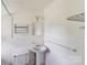 Clean and functional bathroom with white tile, pedestal sink, and essential fixtures at 6300 Mount Pleasant S Rd, Concord, NC 28025