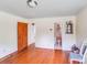 Spacious room with hardwood floors, easy access to other rooms, and natural light at 6300 Mount Pleasant S Rd, Concord, NC 28025
