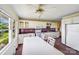 Bright kitchen with white cabinets, purple countertops and accents, white appliances and dining table at 6300 Mount Pleasant S Rd, Concord, NC 28025