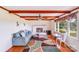 Cozy living room features wooden beams, a white fireplace and large window letting in natural light at 6300 Mount Pleasant S Rd, Concord, NC 28025