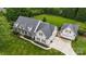Stunning aerial view of home and grounds, featuring lush landscaping and a detached garage at 6409 Barkley Farm Rd, Huntersville, NC 28078