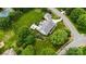 Beautiful home with inviting patio and outdoor fireplace, surrounded by mature trees and landscaping at 6409 Barkley Farm Rd, Huntersville, NC 28078