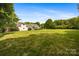 Large backyard showing the lawn and the back of the house at 6409 Barkley Farm Rd, Huntersville, NC 28078