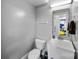 Functional bathroom with a toilet, sink, mirror, and fixtures at 6409 Barkley Farm Rd, Huntersville, NC 28078