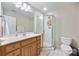 Bright bathroom features a vanity with a marble countertop and a glass-enclosed shower at 6409 Barkley Farm Rd, Huntersville, NC 28078
