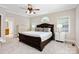 Primary bedroom suite boasts windows and neutral carpet at 6409 Barkley Farm Rd, Huntersville, NC 28078