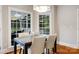 Cozy breakfast nook with hardwood floors features large windows and a stylish light fixture at 6409 Barkley Farm Rd, Huntersville, NC 28078