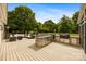 Spacious outdoor deck with built-in kitchen, grill, and lounge area, perfect for entertaining at 6409 Barkley Farm Rd, Huntersville, NC 28078