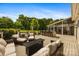 Outdoor deck with kitchen, bar, and lounge areas perfect for enjoying the outdoors at 6409 Barkley Farm Rd, Huntersville, NC 28078