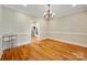 Spacious dining room with hardwood floors and elegant chandelier at 6409 Barkley Farm Rd, Huntersville, NC 28078