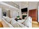 Spacious living room features a stone fireplace, hardwood floors, and an open view to the upper level at 6409 Barkley Farm Rd, Huntersville, NC 28078