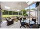 Bright sunroom with comfortable seating, a ceiling fan, and views of the backyard at 6409 Barkley Farm Rd, Huntersville, NC 28078