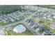 Expansive aerial view of a residential neighborhood with community pool and green spaces at 8829 Keller Ct, Huntersville, NC 28078