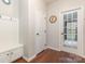 This entryway features hardwood floors, a built-in mudroom bench, and a glass-paneled door at 8829 Keller Ct, Huntersville, NC 28078
