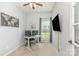 Bright home office with neutral tones, a large window, and a wall-mounted television at 8829 Keller Ct, Huntersville, NC 28078