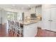 Bright and open kitchen featuring granite countertops, stainless appliances, and a spacious island with seating at 8829 Keller Ct, Huntersville, NC 28078