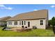 Picture of a backyard with a patio area, a swing set, and a fire pit, great for relaxing or entertaining at 8830 Artesa Mill Ln, Charlotte, NC 28214