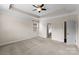 Large bedroom featuring a tray ceiling, neutral paint, and carpet at 8830 Artesa Mill Ln, Charlotte, NC 28214