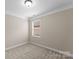 Neutral bedroom with carpet, window, and blank canvas ready for personal touches at 8830 Artesa Mill Ln, Charlotte, NC 28214