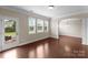 Bright and sunny bonus room with hardwood floors and access to the backyard at 8830 Artesa Mill Ln, Charlotte, NC 28214