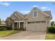Charming home with a two-car garage and well-maintained landscaping at 8830 Artesa Mill Ln, Charlotte, NC 28214