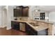 Stylish kitchen featuring granite counters, stainless steel dishwasher, and dark wood cabinetry at 8830 Artesa Mill Ln, Charlotte, NC 28214