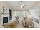 Inviting living room with neutral tones, fireplace, built-ins, and abundant natural light at 8830 Artesa Mill Ln, Charlotte, NC 28214