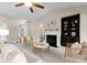Inviting living room showcasing a fireplace, vaulted ceiling, and natural light at 8830 Artesa Mill Ln, Charlotte, NC 28214