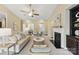 Inviting living room featuring a fireplace, neutral tones, and an open layout flowing into the dining area at 8830 Artesa Mill Ln, Charlotte, NC 28214