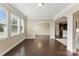 Light-filled living room with large windows, hardwood floors, and elegant architectural details at 8830 Artesa Mill Ln, Charlotte, NC 28214
