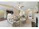 Comfortable living room showcases an open floor plan, fireplace, and stylish furnishings, seamlessly connecting to dining at 8830 Artesa Mill Ln, Charlotte, NC 28214