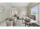 Home office with French doors, neutral palette, and contemporary furnishings, creating a serene work environment at 8830 Artesa Mill Ln, Charlotte, NC 28214