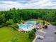 Aerial view of community pool offering a large swimming pool, pool, and a clubhouse at 8830 Artesa Mill Ln, Charlotte, NC 28214