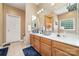 Neutral bathroom with dual sinks, tiled floors and a large vanity area at 8927 Comstock Ct, Locust, NC 28097