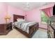 Cozy bedroom with a large bed, neutral walls and an abundance of natural light at 8927 Comstock Ct, Locust, NC 28097