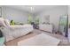 Bedroom with white walls, bright windows and carpet floors at 8927 Comstock Ct, Locust, NC 28097