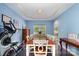 Dining room featuring blue walls, a large table, and a hardwood floor at 8927 Comstock Ct, Locust, NC 28097