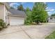 Attached garage with a large concrete driveway, and ample parking space at 8927 Comstock Ct, Locust, NC 28097