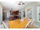 Eat-in kitchen featuring an island with granite countertops, stainless steel appliances, and room for seating at 8927 Comstock Ct, Locust, NC 28097