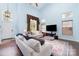 Bright living room featuring soaring ceilings, hardwood floors, and plentiful natural light at 8927 Comstock Ct, Locust, NC 28097