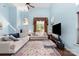Spacious living room with soaring ceiling, hardwood floors, and neutral decor at 8927 Comstock Ct, Locust, NC 28097