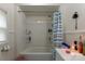 Bathroom featuring a shower/tub combo with a shower curtain, and white wainscoting on the walls at 100 Lanier St, Mount Holly, NC 28120