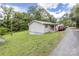 Quaint home featuring light siding, green lawn, and gravel driveway at 100 Lanier St, Mount Holly, NC 28120